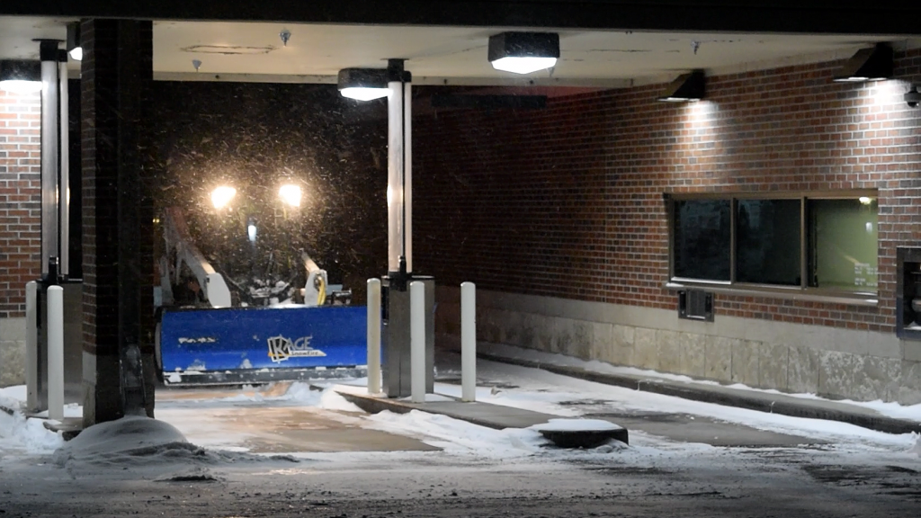 SnowFire plow scraping bank drive through island