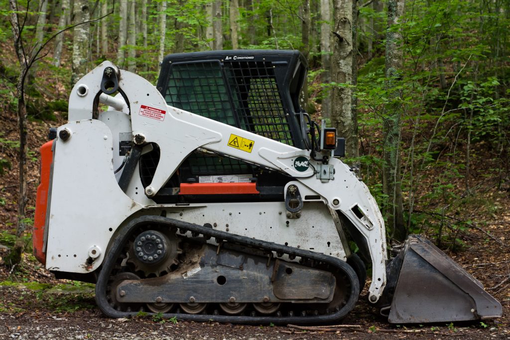 Compact Track Loader in Forest